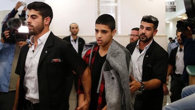 Ahmed Manasra, 14, leaves the district court in Jerusalem on November 7, 2016 after being sentenced to 12 years in jail for taking part in a knife attack on two Israelis in October, 2015. Ahmad Gharabli / AFP