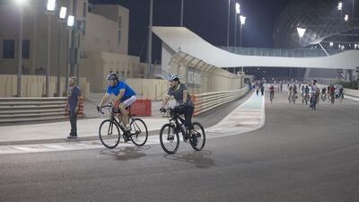 Sheikh Hazza bin Zayed bikes around Yas Marina Circuit with Executive Council members and residents.