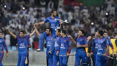 Nowroz Mangal is carried off the field by his teammates after Afghanistan won the inaugural Desert T20 title. Ruel Pableo / The National