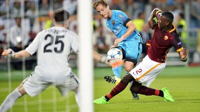 Barcelona's Ivan Rakitic plays a cross against AS Roma on Wednesday night during his side's Champions League contest against the hosts in Rome. Andreas Solaro / AFP