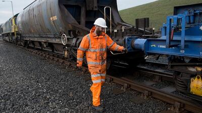The driver of a potash freight train makes final checks before leaving the sidings at the surface works of Cleveland Potash mine. Ian Forsyth / Getty Images