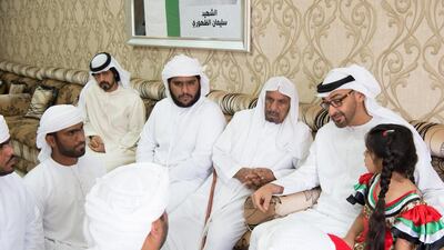 Sheikh Mohammed bin Zayed, Crown Prince of Abu Dhabi and Deputy Supreme Commander of the Armed Forces, offers condolences to the family of Soliman Mohamed Al Dhuhouri, who died while serving with the UAE Armed Forces in Yemen. Seen with Sheikh Khalifa bin Tahnoon, Director of the Martyrs’ Families’ Affairs Office of the Abu Dhabi Crown Prince Court. Mohamed Al Suwaidi / Crown Prince Court - Abu Dhabi