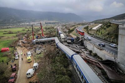 Police and emergency crews search the debris after the train accident. AFP