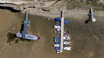 Boats are stuck in the dried-up bed of the drought-hit Doubs river on the border with France in Les Brenets, Switzerland. Reuters