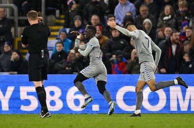 Everton's Idrissa Gueye celebrates scoring their winner against Crystal Palace with teammate with Dwight McNeil. Reuters