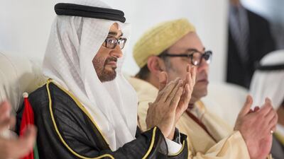 Sheikh Mohammed bin Zayed, Crown Prince of Abu Dhabi Deputy Supreme Commander of the Armed Forces (C) applauds a performance at the 44th UAE National Day celebrations at Zayed Sports City. Mohamed Al Hammadi / Crown Prince Court - Abu Dhabi