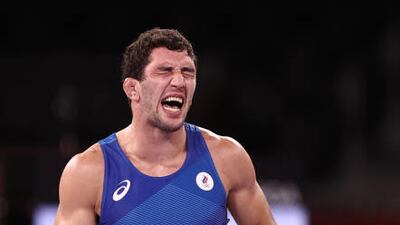 Team ROC's Zaurbek Sidakov celebrates victory in the men's 74kg freestyle wrestling final.