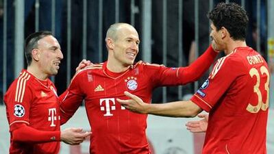 Mario Gomez, right, celebrates with his Bayern Munich teammates Franck Ribery, left, and Arjen Robben after scoring one of his four goals during the 7-0 rout of Basel.