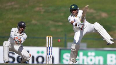 Misbah-ul-Haq, right, has become the first Pakistan captain to score hundreds in three consecutive Test innings. Aamir Qureshi / AFP