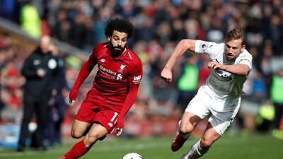 Liverpool's Mohamed Salah in action with Burnley's Charlie Taylor. Reuters