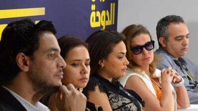 A press conference at the Doha Tribeca Film Festival 2012. From the look on their faces, it seems there's a question from the audience that is either a) utterly incomprehensible, or b) in a foreign language