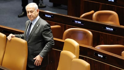 Prime Minister Benjamin Netanyahu stands on the floor of the Knesset, the country's parliament in Jerusalem. AFP