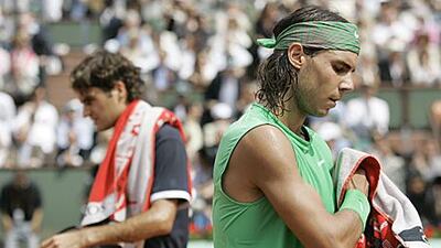 The chances of Roger Federer, left, ending Rafael Nadal's remarkable run at Roland Garros remain slim.