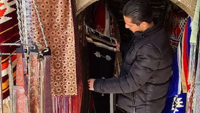 Samer Derki’s 50-year-old store showcases several brocade fabrics and rugs.