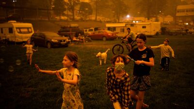 Children playing in the southern New South Wales town of Bega where they camped after being evacuated from nearby sites affected by bushfires, on December 31, 2019. Wildfires will rise sharply in coming decades due to global warming, and governments are ill-prepared for the death and destruction caused, the UN warned on February 23. AFP