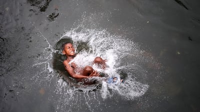 A boy plays in the river at Ribeira Afonso, Sao Tome island, Sao Tome and Principe. EPA