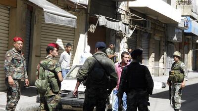 Lebanese army soldiers inspect a site where clashes took place on Saturday in the Lebanese town of Baalbek on Sunday. Ahmad Shalha / Reuters