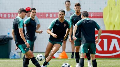 Portugal's Cristiano Ronaldo, centre, takes part in training. Victor R Caivano / AP Photo