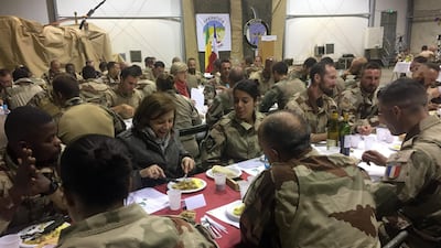 French defence minister Florence Parly dines with armed forces personnel, celebrating New Year's Eve in 2017, in Tessalit, Mali. AFP