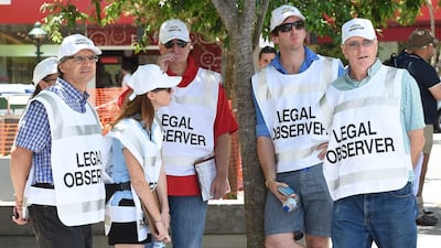Legal observers in the central business district of Brisbane in the lead up to the G20 leaders summit. (Dave Hunt / EPA)