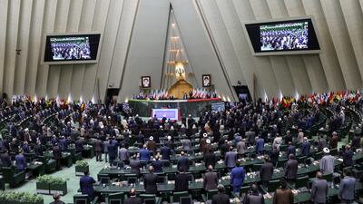 A general view of the Iranian parliament floor as attendees stand for the national anthem during the swearing-in ceremony of Iran's new President Ebrahim Raisi at the parliament in Tehran, Iran.