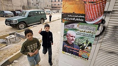 Hamas posters hang on a wall outside their main Damascus administrative office near Yarmouk Camp in January 2009.