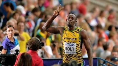 Jamaica's Usain Bolt gestures after competing in a men's 100-metre heat at the World Championships in Luzhniki Stadium at Moscow.