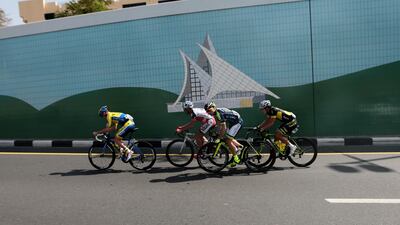 The lead pack of cyclists ride during the fourth stage of the Dubai Tour cycling race.