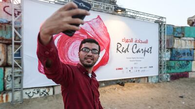 A Palestinian man takes a selfie during the third edition of the Red Carpet Film Festival in Gaza City, Gaza, in 2017. Getty.
