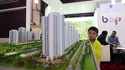 A boy looks at a model of Jaypee Greens project at the Indian Property Show at the Dubai World Trade Centre. Developers confirm interest in real estate has increased due to favourable exchange rates.