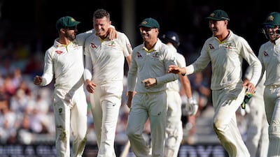Australia bowler Peter Siddle, second left, celebrates after taking the wicket of Joe Denly. PA