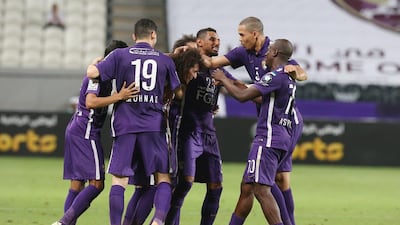 Al Ain players congratulate playmaker Omar Abdulrahman, centre. Mostafa Reda / Aletihad)