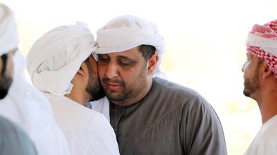 Relatives and friends giving their condolences after the funeral to Ahmed Mohammed Sayed Rabiya Saerdi , uncle of the seven Emirati children who died of smoke inhalation on Monday in Rul Dhadna village in Fujairah. Pawan Singh / The National