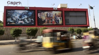 Billboards of a local cinema display films showing in Karachi, Pakistan, Saturday, October 1, 2016. Pakistani cinemas have stopped showing Indian films after India banned Pakistani actors because of tensions over Kashmir. Fareed Khan / AP