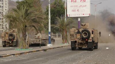 Military vehicles of the Southern Resistance fighters move during clashes with Houthi fighters on a street in Yemen's southern port city of Aden on July 17. Reuters
