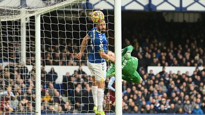 Jordan Pickford and Andros Townsend of Everton fail to stop a shot from Emiliano Buendia of Aston Villa. Getty