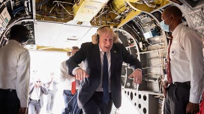 Boris Johnson boards an Indian military Chinook helicopter for a flight to the new JCB factory at Vadodara in India's Gujarat state. Reuters