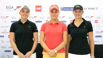 Charley Hull, centre, poses with Nanna Koerstz Madsen and Emily Kristine Pedersen in Dubai on Monday. David Cannon / Getty Images