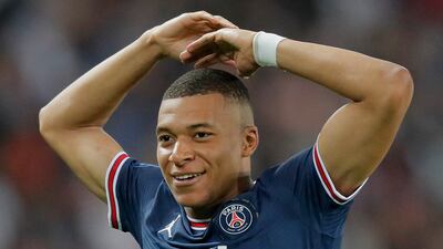 Kylian Mbappe celebrates after scoring his third goal. AP