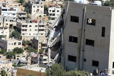 Half the apartment complex collapsed when a bomb was detonated during a raid by Jordanian security forces. AP
