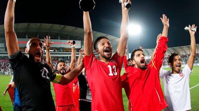 Bahrain players celebrate with the trophy. EPA