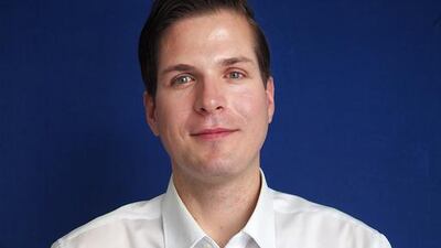Robert Boehme with a wheel from the Part Time Scientists’ lunar rover. Delores Johnson / The National