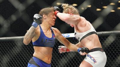 Holly Holm lands a punch against Germaine de Randamie at UFC 208 in New York in 2017. AFP