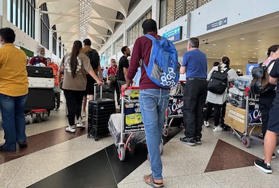 Passengers at the Terminal 1 departure area at the Dubai International Airport in Dubai.