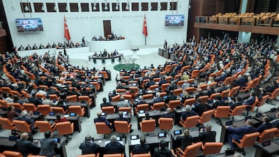 Members of Turkey's parliament in Ankara voting on a bill offering limited amnesty for Kurdish PKK militants. AFP