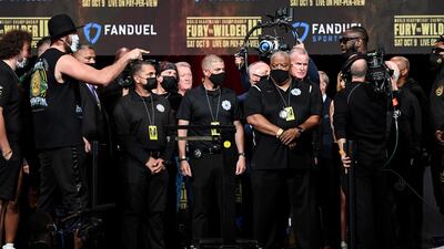 Tyson Fury (L) and Deontay Wilder face-off from afar. EPA