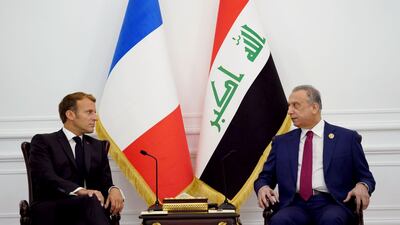 Iraqi Prime Minister Mustafa Al Kadhimi meets Mr Macron ahead of the summit. Iraqi Prime Minister Media Office / Reuters