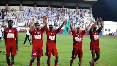 Al Shaab players celebrate their 2-1 victory over Emirates last week. Victory against arch rivals Sharjah tonight will secure them a return to the top flight for the first time since being relegated in 2008/09. Al Ittihad