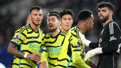 Arsenal players react after the final whistle having beaten Brighton 3-0. AP