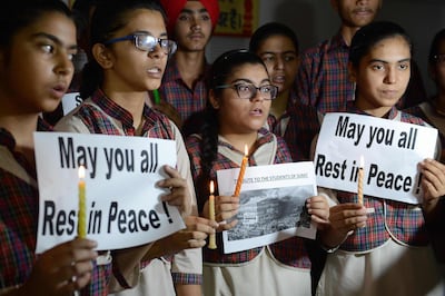 Indian students in Amritsar, Punjab hold a vigil for the victims of a fire in Surat on May 25, 2019. AFP
